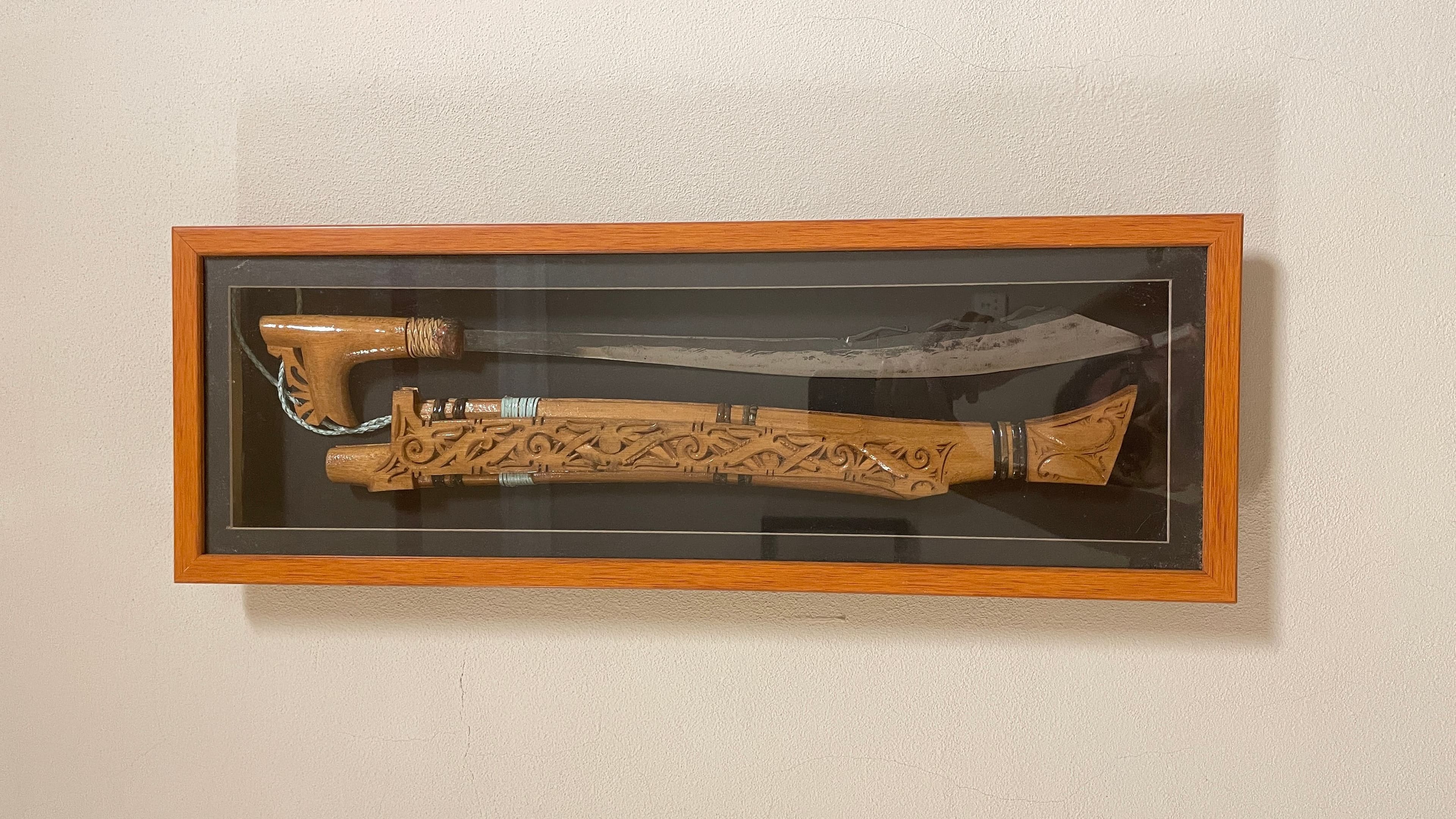custom parang displayed in a glass frame for decorative purposes