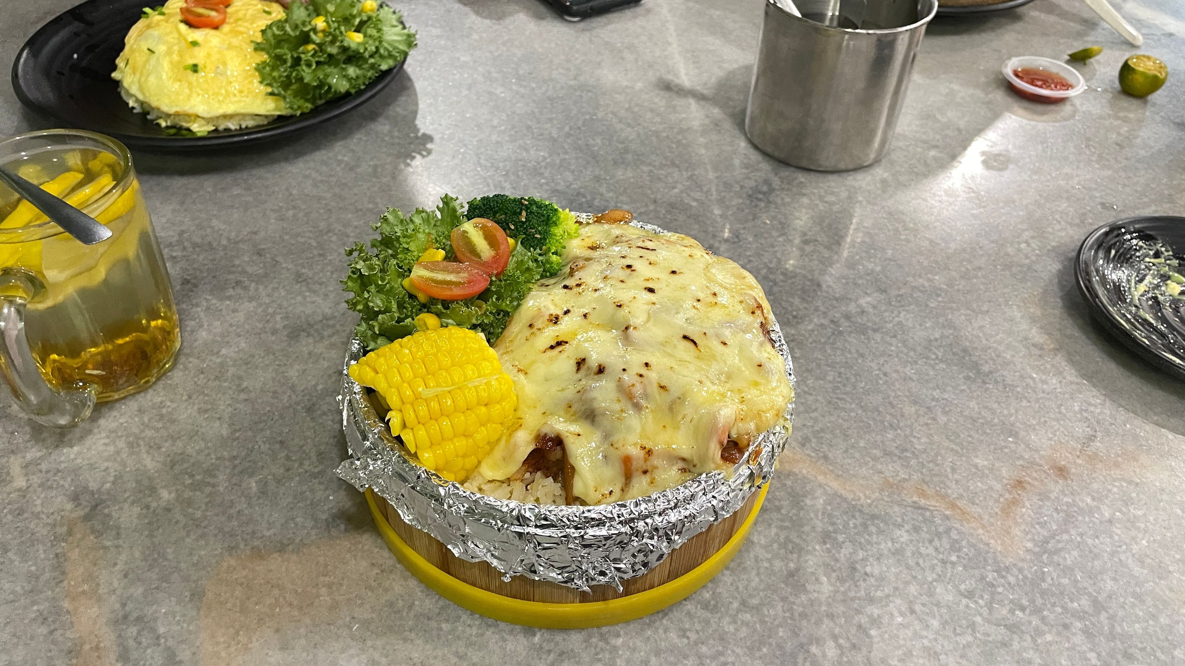 Image of cheesy tomato chicken at welcome restaurant